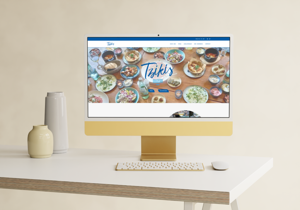 Desktop met website preview van Tzikis